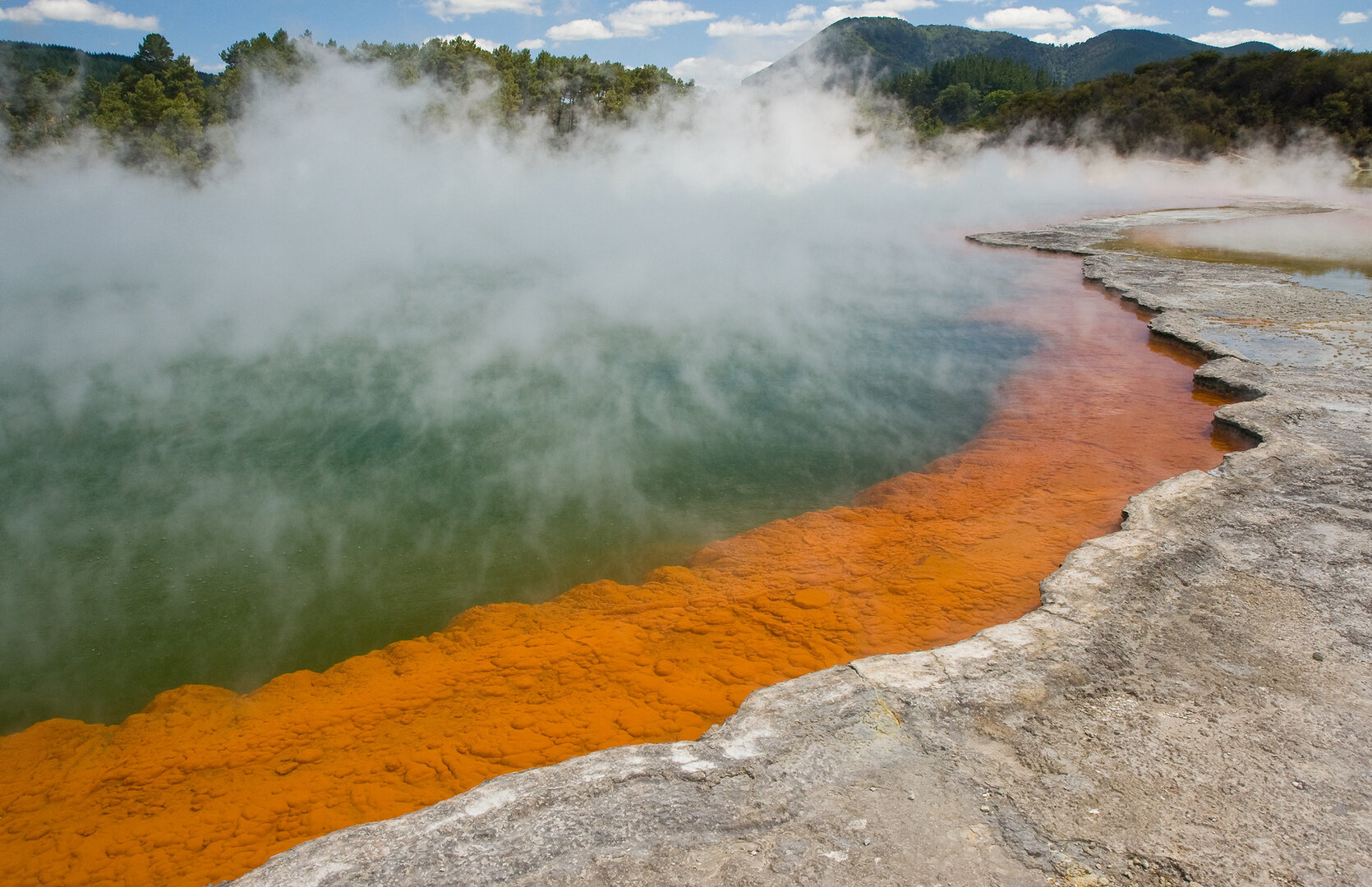 Colorful geothermal pools and steaming terraces at Wai-O-Tapu Thermal Wonderland